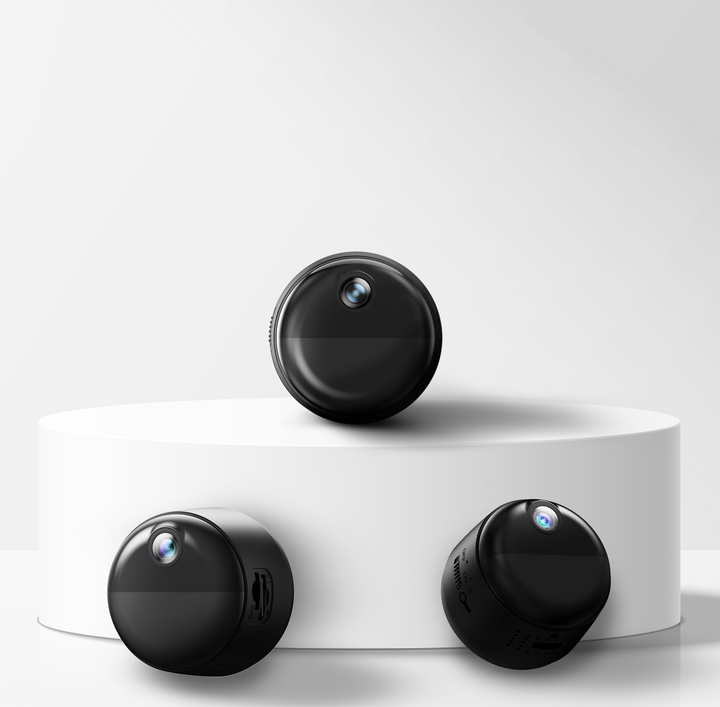 Three black cylindrical mini magnetic wifi cameras on a white platform with a light gray background
