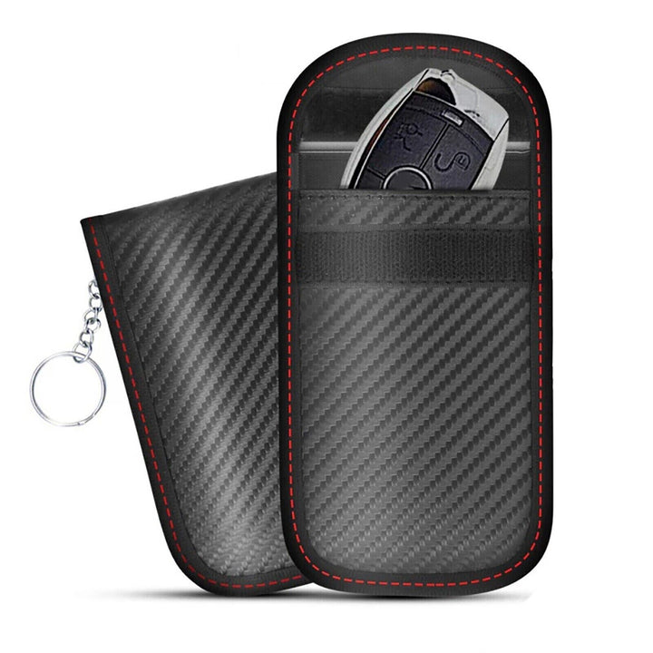 Two black carbon-fiber pattern pouches with red stitching, one holding a car key fob and keyring attached.