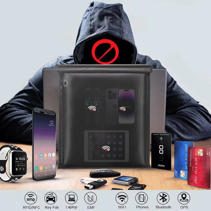 A set of personal electronic devices, cards, and a key fob displayed with a black signal-blocking pouch.