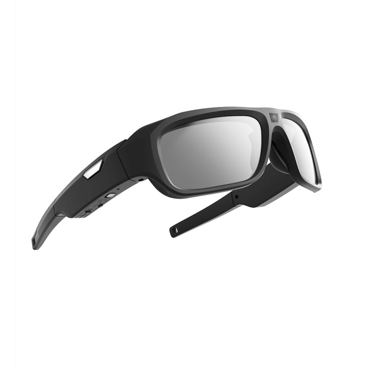 Angled view of black surveillance sunglasses showing a centred camera lens and port positions.