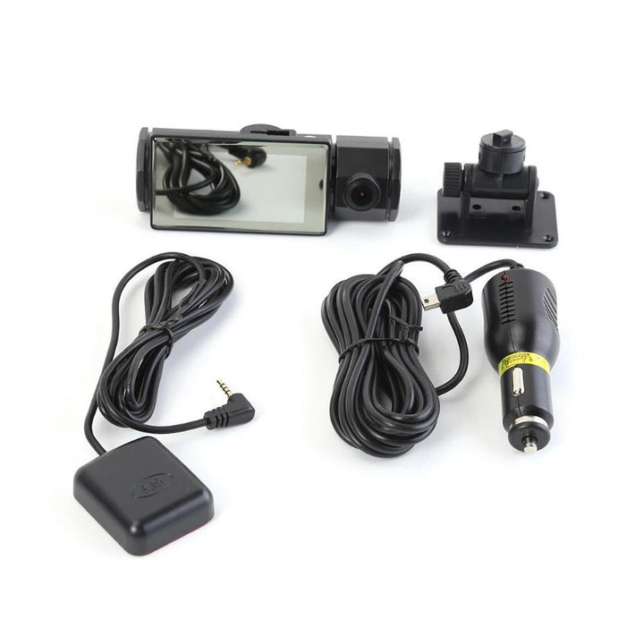 Contents of the product box. A top-down view showing separated Dashcam, Mounting Bracket, Car AC Adapter and GPS Tag.